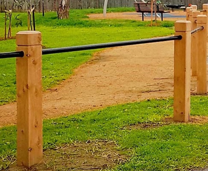 Timber bollards protecting a park pathway and playground in Heidelberg West